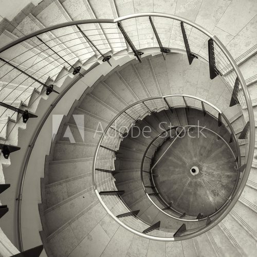 Upside view of a spiral staircase  Schody Fototapeta