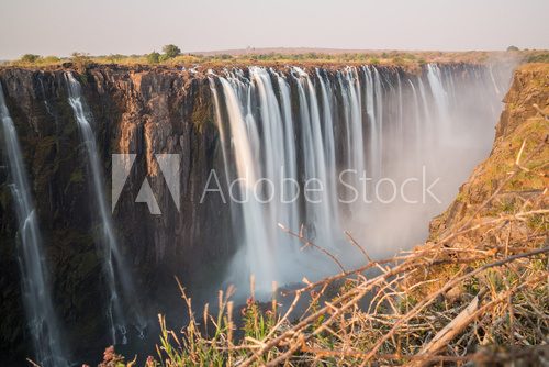 Silk water in Victoria Falls, View from Zimbabwe  Fototapety Wodospad Fototapeta