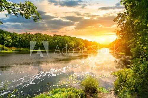 Sunset over the river in the forest  Krajobrazy Obraz