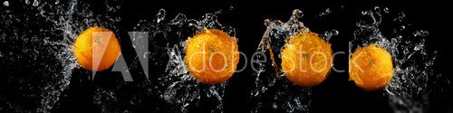 Set of fresh oranges in water splash  Obrazy do Łazienki Obraz