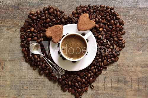 Cup of coffee with heart-shaped chocolate truffles.  Obrazy do Jadalni Obraz