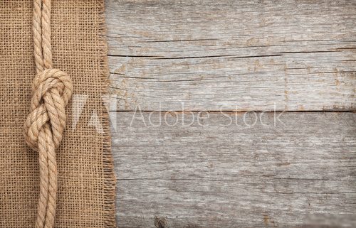 Ship rope on wood and burlap texture background  Styl skandynawski Fototapeta