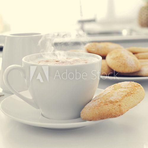 cappuccino and biscuits on the kitchen table  Obrazy do Kuchni  Obraz