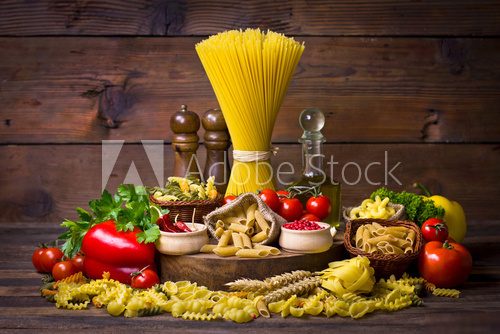 Variety of uncooked pasta and vegetables  Obrazy do Kuchni  Obraz