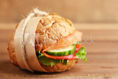 Sandwich with salmon on wooden background  Obrazy do Kuchni  Obraz