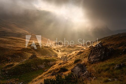 Dramatic fogy landscape with sunbeams  Fototapety Góry Fototapeta