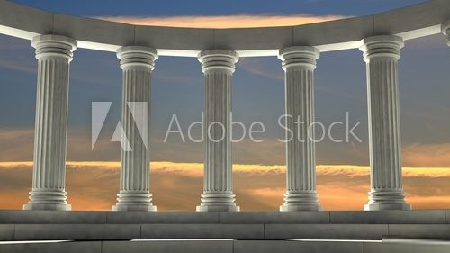 Ancient marble pillars in elliptical arrangement with orange sky Styl Klasyczny Fototapeta