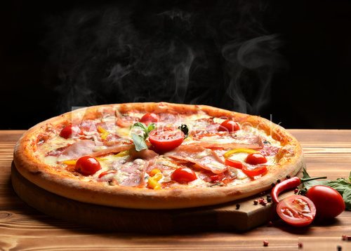 Hot big whole tasty pizza with melting cheese bacon tomatoes ham Obrazy do Jadalni Obraz