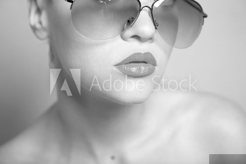 Fashion portrait of young pretty woman with glasses  Ludzie Plakat