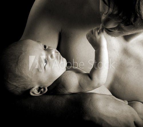Close up of a newborn touching his fathers face  Fototapety Czarno-Białe Fototapeta