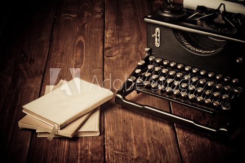 Vintage typewriter and old books, touch-up in retro style  Fototapety Sepia Fototapeta