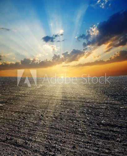 sunset over black field  Zachód Słońca Fototapeta