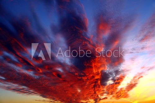 Sunset behind clouds  Zachód Słońca Fototapeta