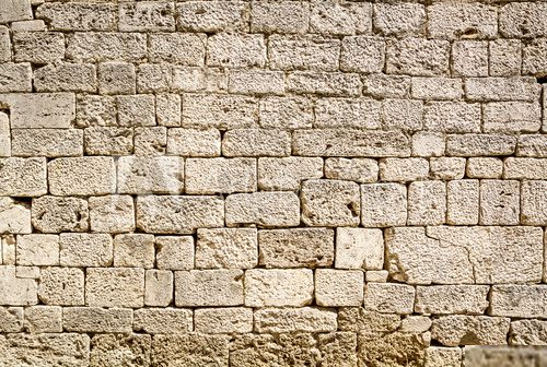 Ancient wall built of white stone  Mur Fototapeta