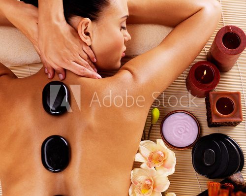 Adult woman having hot stone massage in spa salon  Obrazy do Salonu SPA Obraz