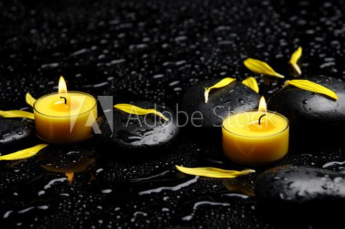 Spa concept-two candle with yellow flower petals on pebbles  Obrazy do Salonu SPA Obraz