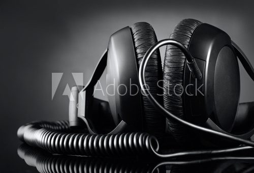 Modern headphones over dark background  Muzyka Obraz