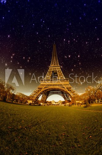 Stars and Night Sky above Eiffel Tower in Paris  Fototapety Wieża Eiffla Fototapeta
