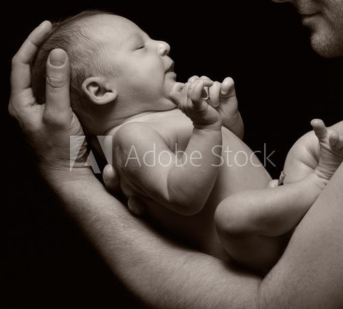 Father and his newborn baby.  Fototapety Sepia Fototapeta