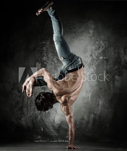 Young b-boy man with naked torso doing brake dancing movements  Sport Fototapeta