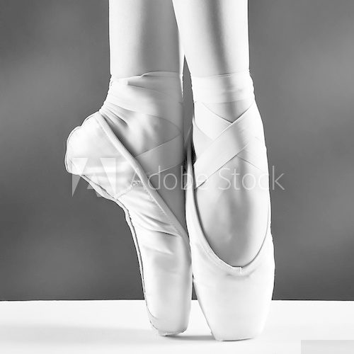 A photo of ballerina's pointes on black background  Fototapety do Szkoły Tańca Fototapeta