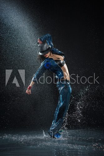 Wet dancing woman. Under waterdrops. Studio photo  Fototapety do Szkoły Tańca Fototapeta