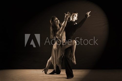 Latino dancers in ballroom isolated on black background  Fototapety do Szkoły Tańca Fototapeta