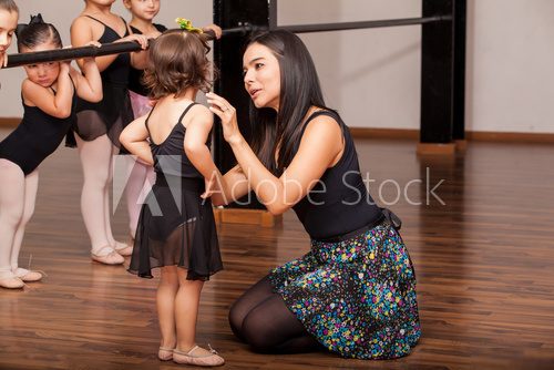 Teacher comforting a dance student  Fototapety do Szkoły Tańca Fototapeta