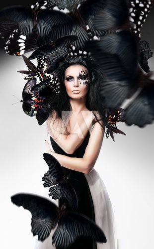 Woman with black hair and art make up and butterflies  Motyle Fototapeta