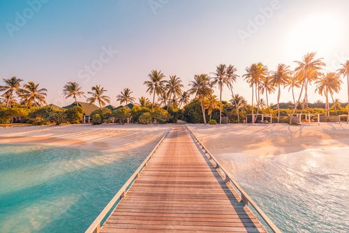 Amazing sunset panorama at Maldives. Luxury resort villas seascape with soft led lights under colorful sky. Beautiful twilight sky and colorful clouds. Beautiful beach background for vacation holiday Fototapety do Salonu Fototapeta