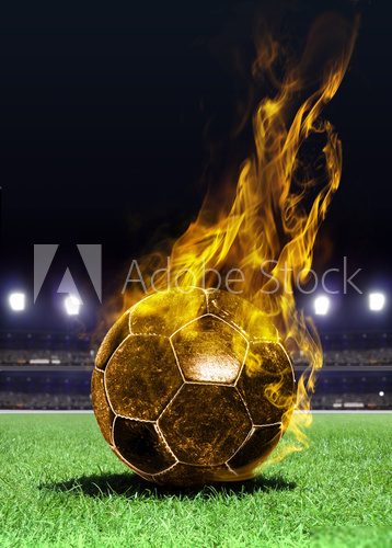 fiery soccer ball on field  Stadion Fototapeta