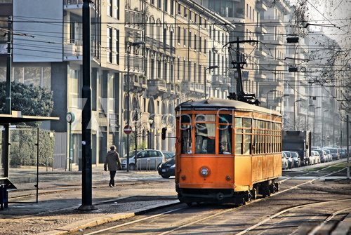 Old vintage orange tram on the street of Milan, Italy Plakaty do Salonu Plakat