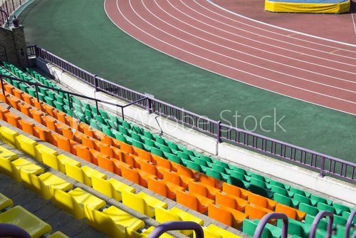 rows of plastic seats at stadium  Stadion Fototapeta