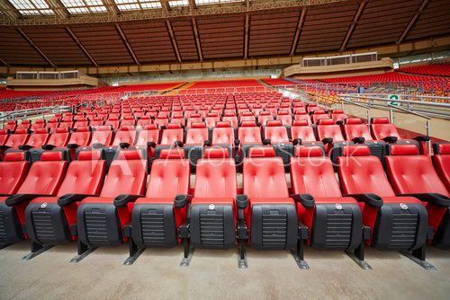 Rows of red armchairs at stadium  Stadion Fototapeta