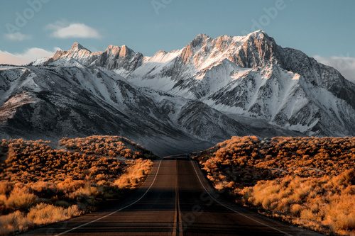View of road leading towards snowy mountains Krajobraz Fototapeta