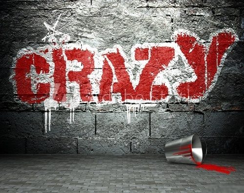 Wyraziste graffiti CRAZY na surowej ceglanej ścianie Fototapety Graffiti Fototapeta