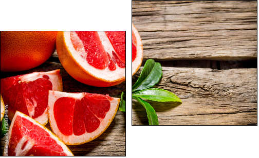 Fresh cut grapefruit with leaves. On wooden table. - Obraz dwuczęściowy, Dyptyk