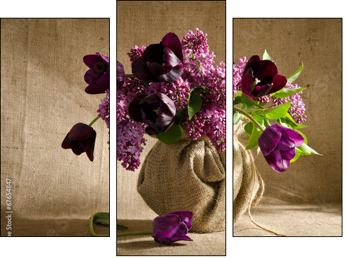 Beautiful bouquet of tulips with sprigs of lilac in a vase on a  - Obraz trzyczęściowy, Tryptyk