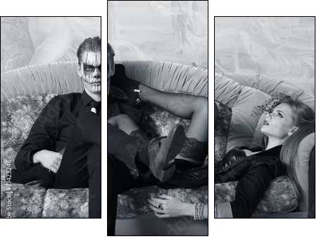 young man and woman on the sofa. makeup in Halloween theme  - Obraz trzyczęściowy, Tryptyk