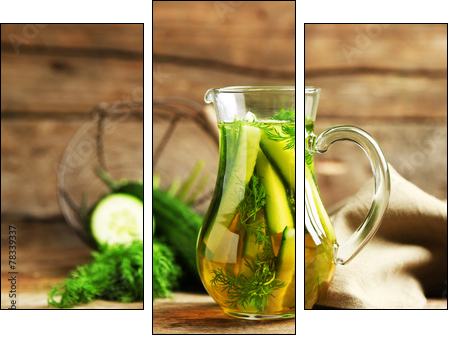 Glass ewer with fresh organic cucumber water on wooden table  - Obraz trzyczęściowy, Tryptyk