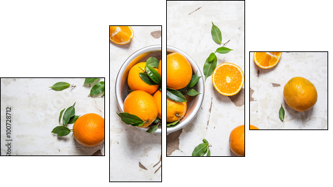 Orange style. Fresh oranges with leaves in a Cup . - Obraz czteroczęściowy, Fortyk
