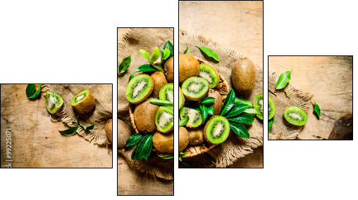 Kiwi fruit in basket with leaves on the old fabric. - Obraz czteroczęściowy, Fortyk