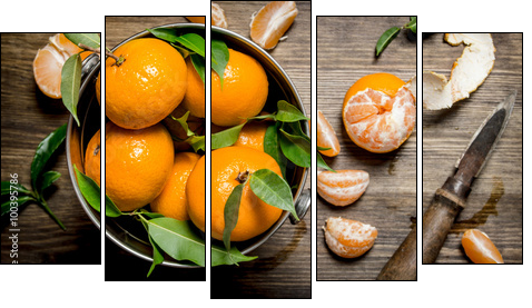 Fresh tangerines with a knife and peeled mandarins in the bucket. - Obraz pięcioczęściowy, Pentaptyk