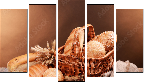 Different bread on table on brown background  - Obraz pięcioczęściowy, Pentaptyk