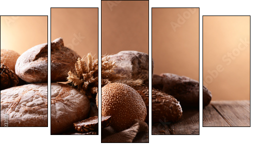 Different bread on table on brown background  - Obraz pięcioczęściowy, Pentaptyk