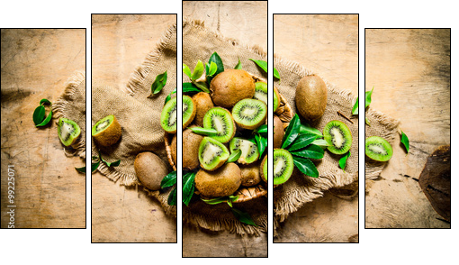 Kiwi fruit in basket with leaves on the old fabric. - Obraz pięcioczęściowy, Pentaptyk